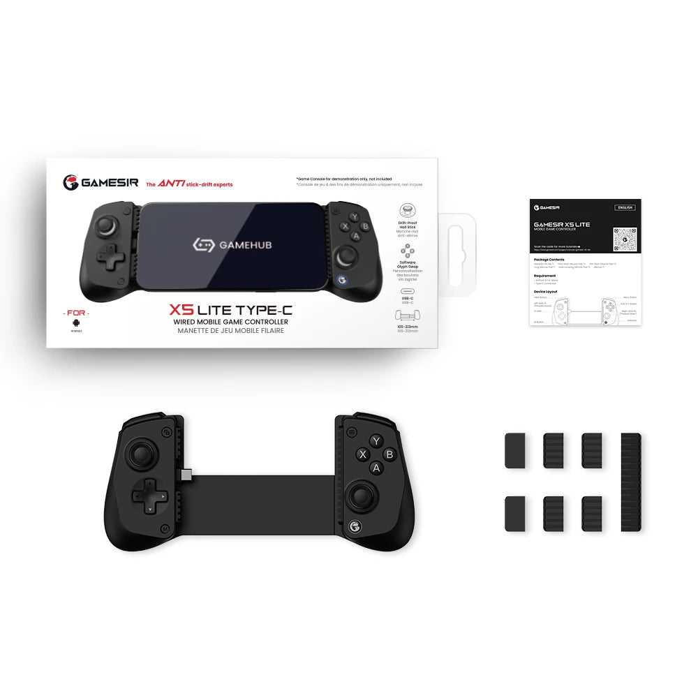 Black gaming controller with packaging and accessories on a white background