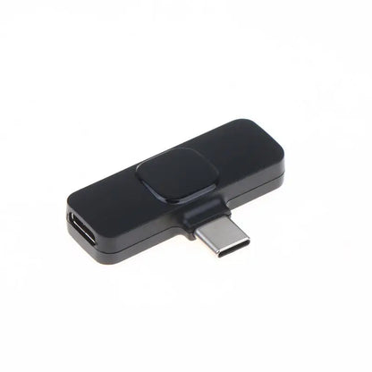 A black USB-C to HDMI adapter dongle with a matte finish, shown on a plain white background.