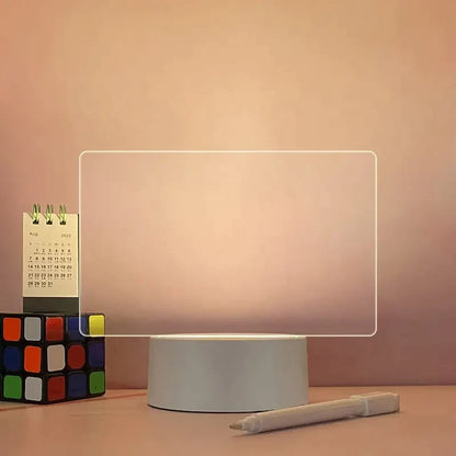 Rectangular light on a stand with a pen and calendar in the background LED acrylic message board with light-up writing