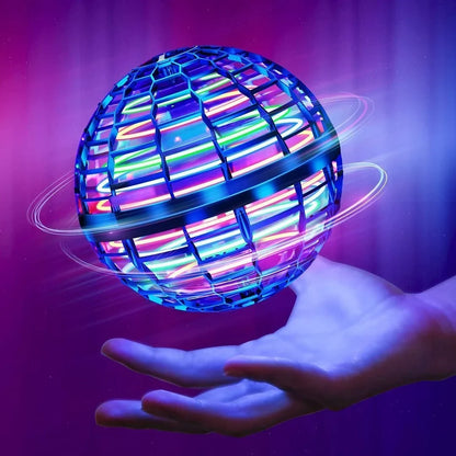 Mini hand-controlled flying spinner toy with neon blue, pink, green, and purple light bars floating above an open hand against a purple and blue gradient background.